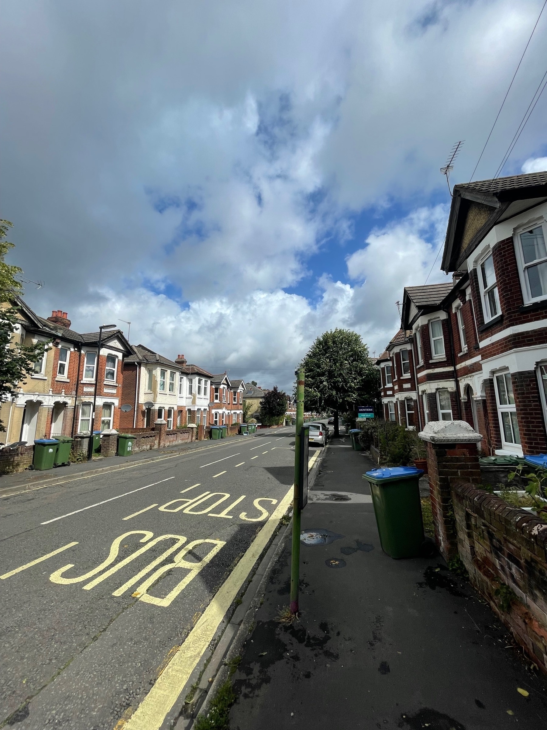A street in a very windy Southampton with some moody looking clouds and a few house hold bins not taken in ! 