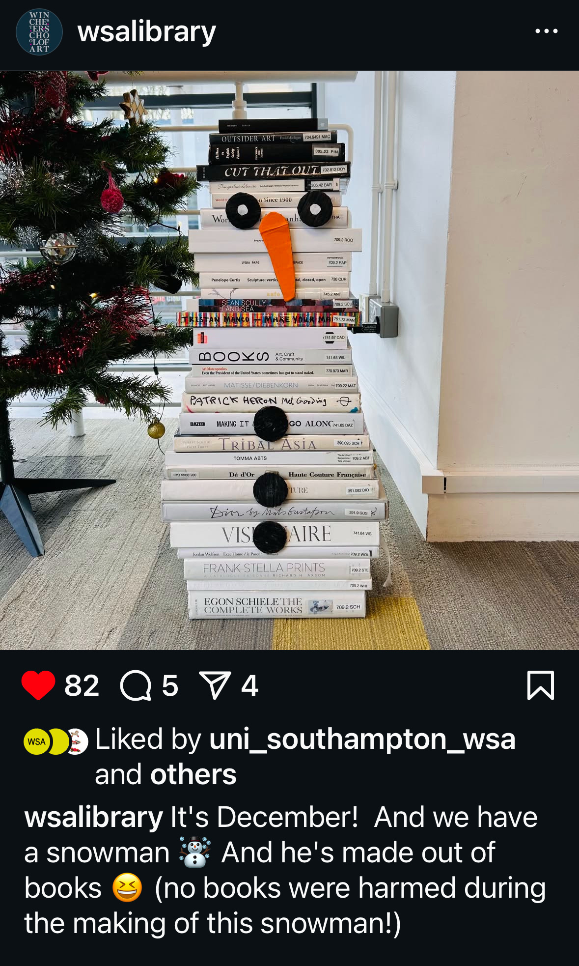 screen shot of an Instagram post from WSA Library of a snowman they constructed out of various width white spine books - the caption lets us know that no books were harmed in making the snowman