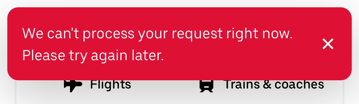 A red error message states an inability to process a request, advising to try again later, displayed above icons for flights and trains & coaches.