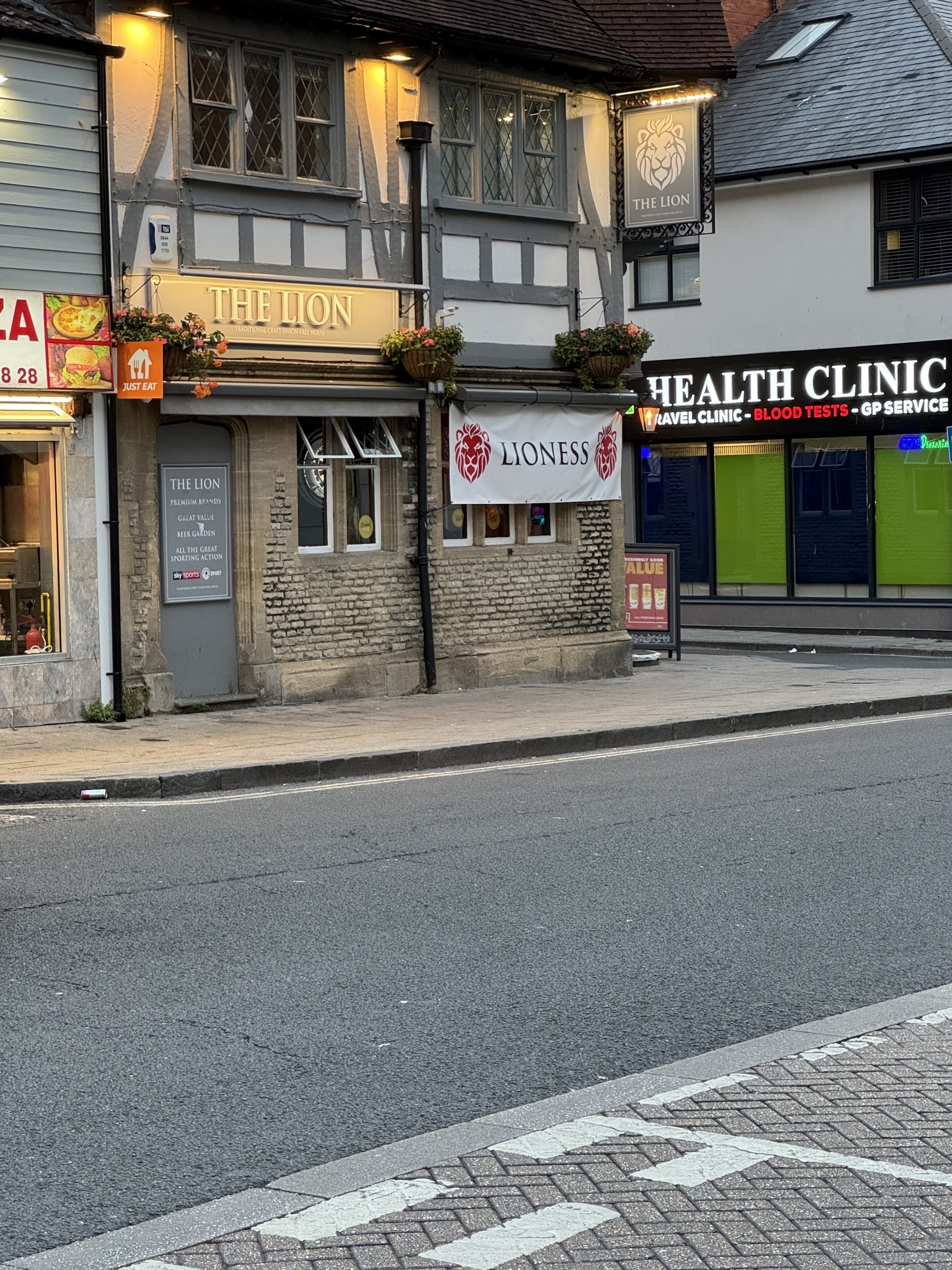 A street view features "The Lion" pub with a "Lioness" banner