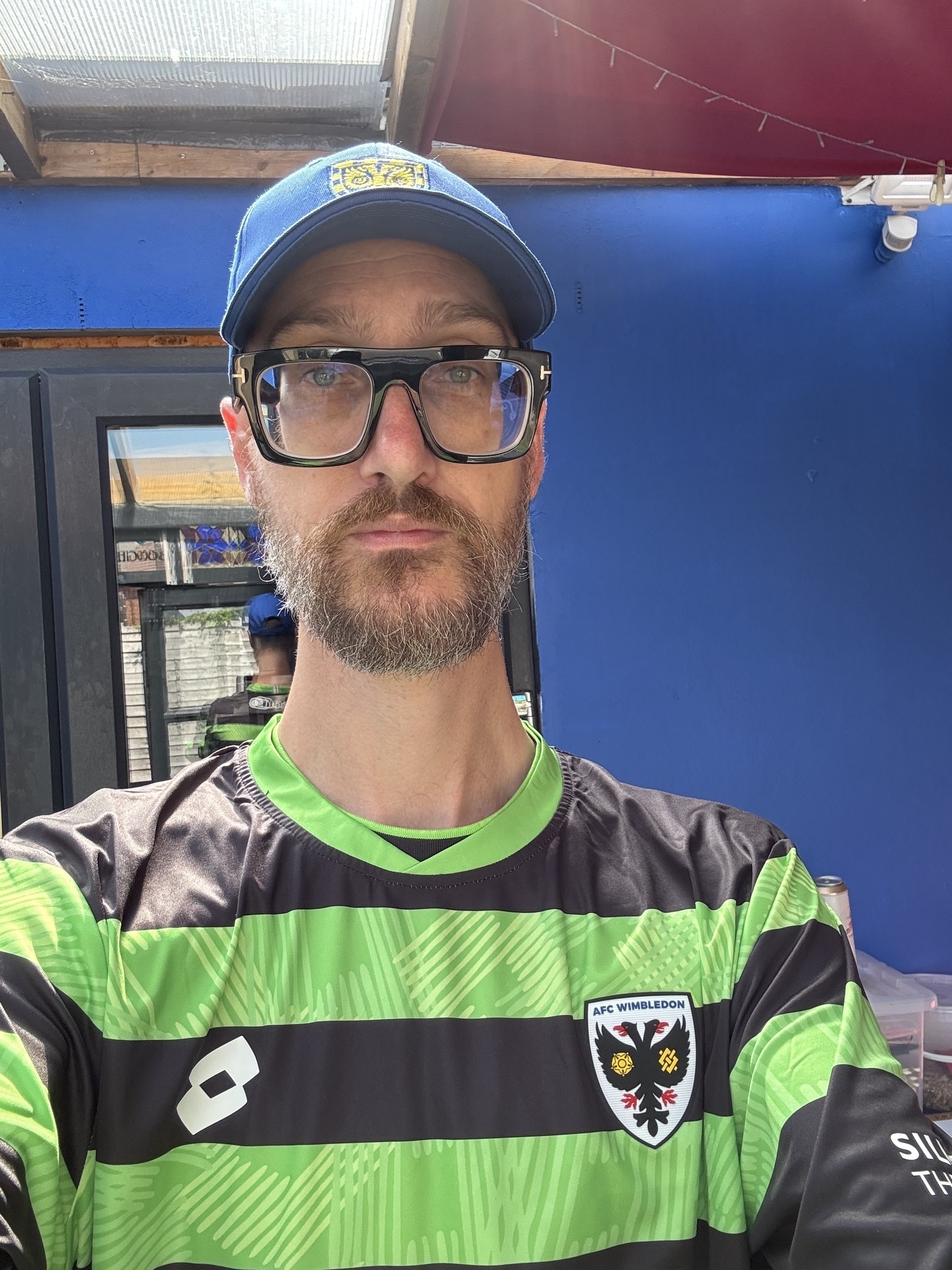 selfie photo wearing new AFC Wimbledon hat and away top