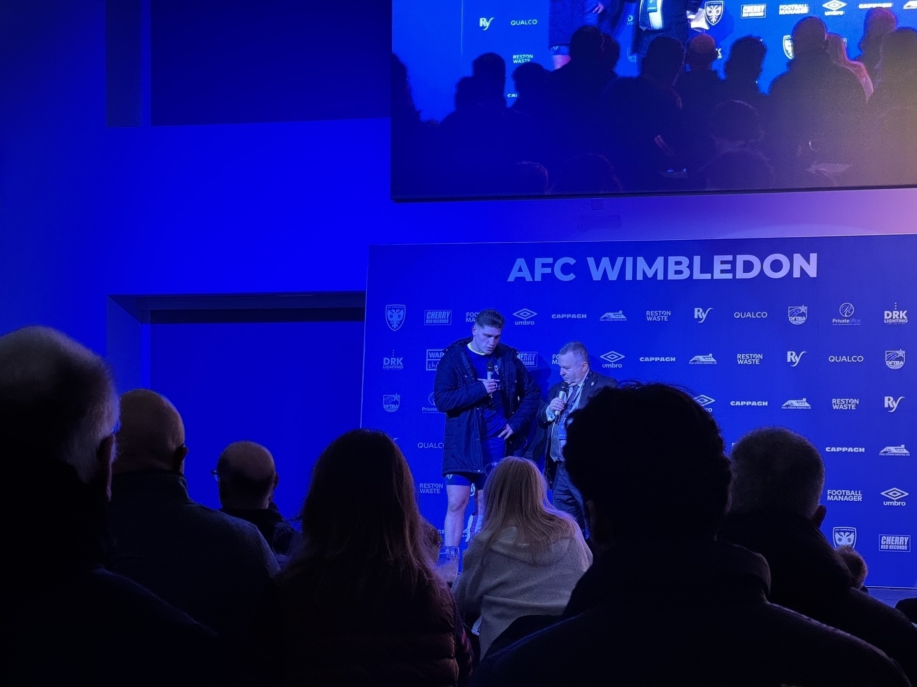 Photo of Matty Stevens getting man of the match award after the game in the 1889 lounge 