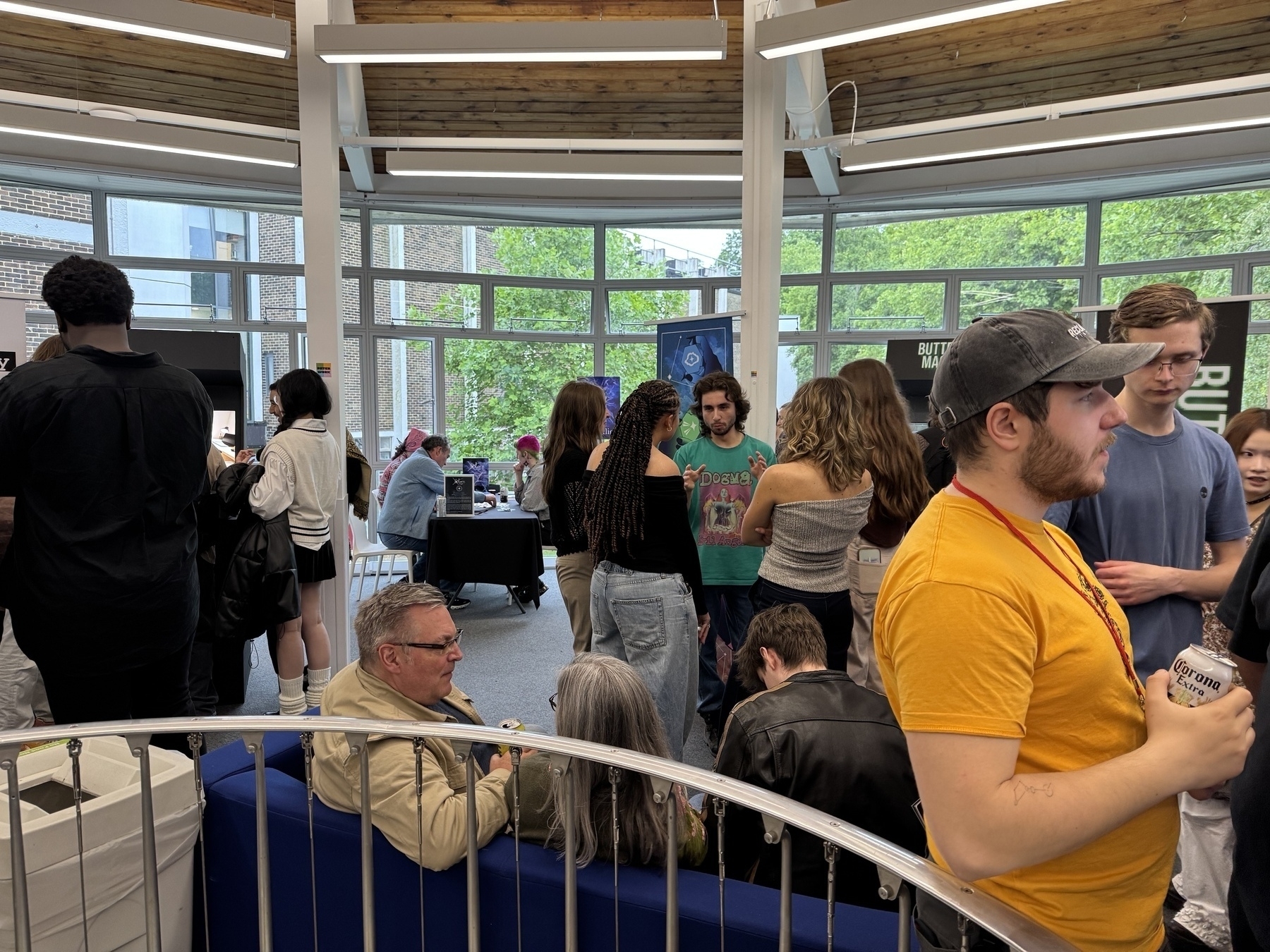 People playing games around arcade machines at our degree show event in Winchester 