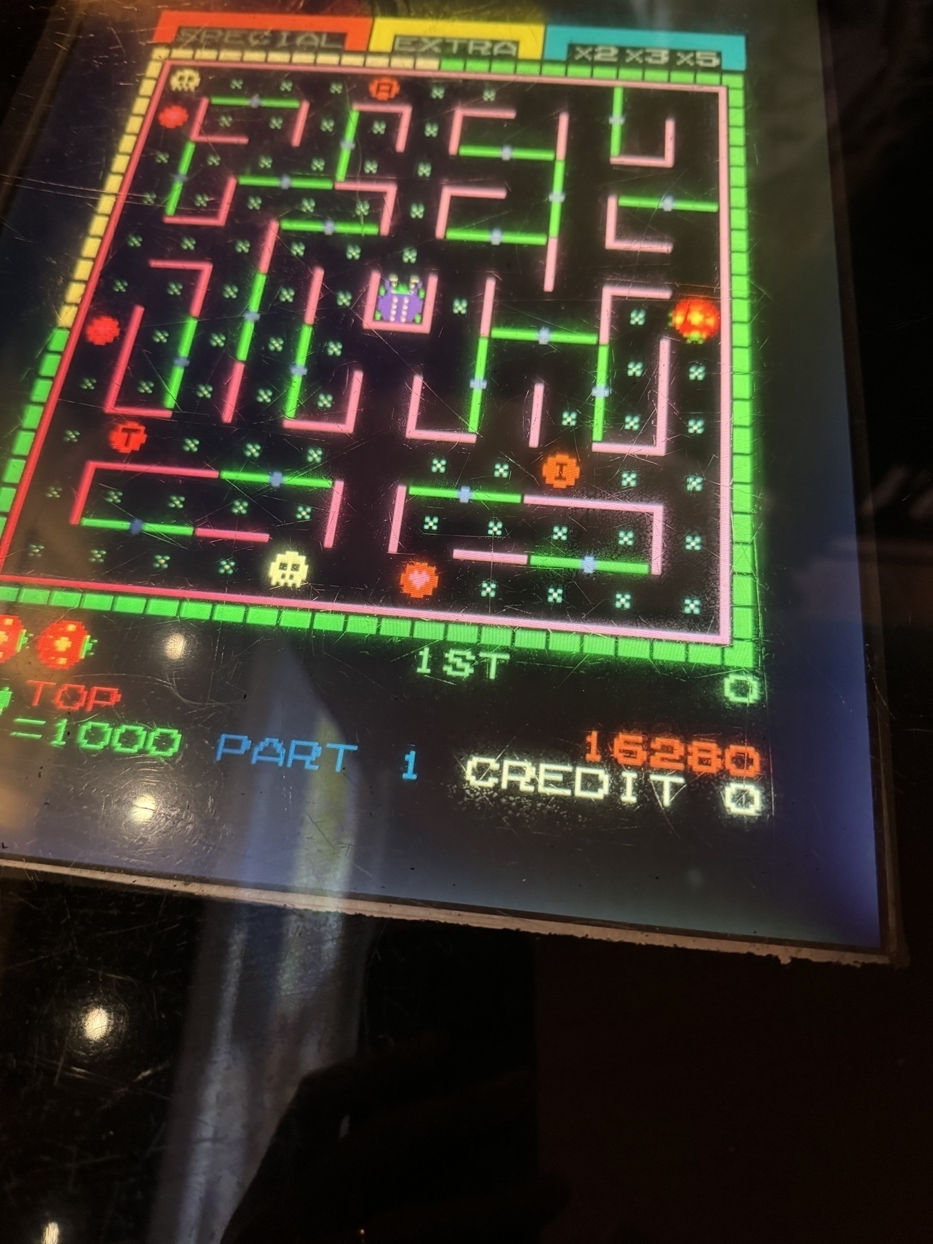 Photo of table top iCade arcade machine in the pub. Showing Ladybird game. Spend £2 and died a lot - played 1942 , burgertime and another I forgot name of 