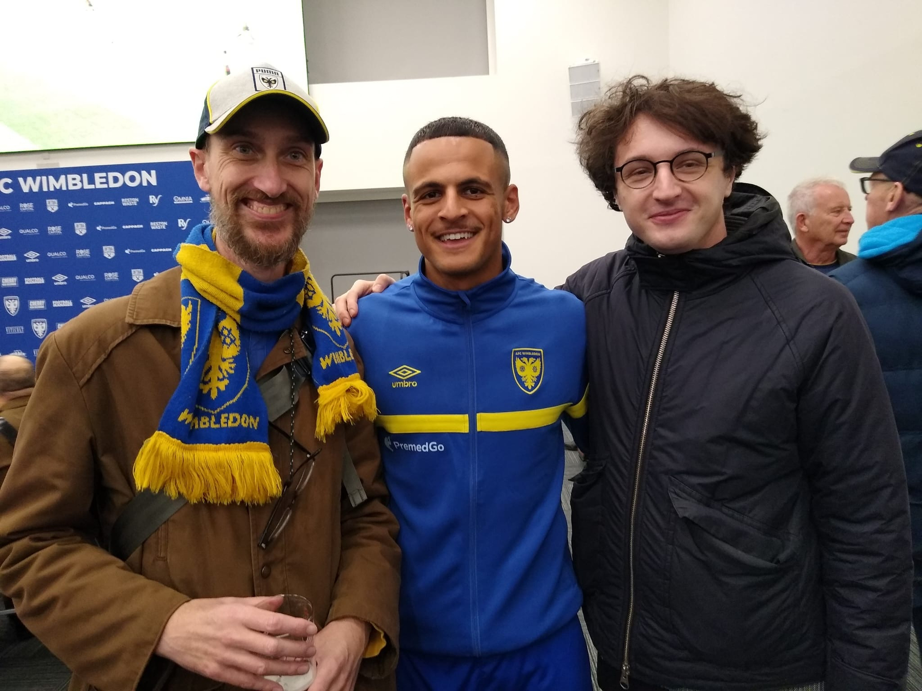 Photo with Ali Al Hamadi posing together next to Adam Procter and friend at AFC Wimbledon